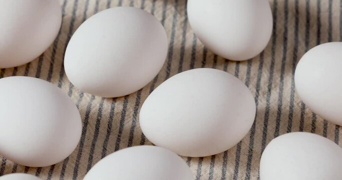 Panning Over Organic Raw White Eggs in a Bunch