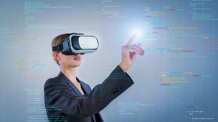 Project manager coding engineering prompt while using VR glasses. Skilled businesswoman pointing...
