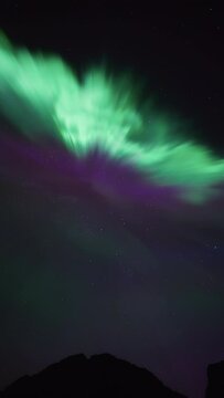 Extremely bright and beautiful aurora substorm displaying detailed motion above a mountain in northern Norway on September 18th, 2023.