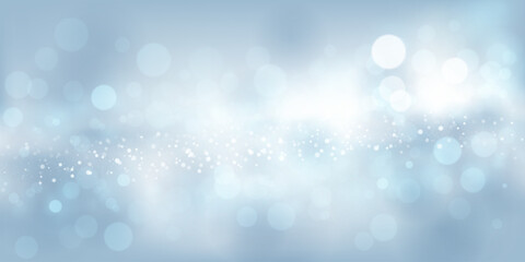 Abstract background in light blue tones with many shiny sparkles, some of which are in focus and others are blurred, creating a captivating bokeh effect.