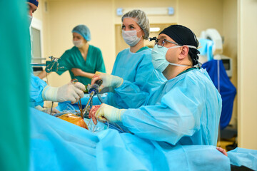 surgeons work in the operating room