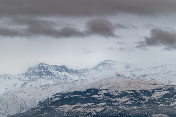 Panoramic view of Sierra Nevada (Granada, Spain) at sunset after a heavy snowfall in spring