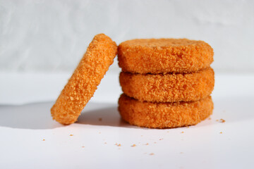 A stack of fried camembert on white background