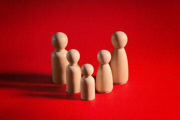 Family people figures on red background. Concept of family, values, unity, togetherness and relationship.