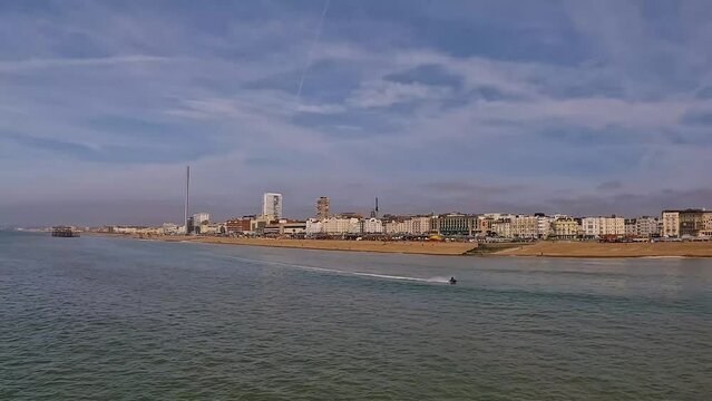 Beautiful Brighton beach view.Brighton beach seafront walk and promenade, East Sussex, UK, tourist enjoying a recent uk heatwave