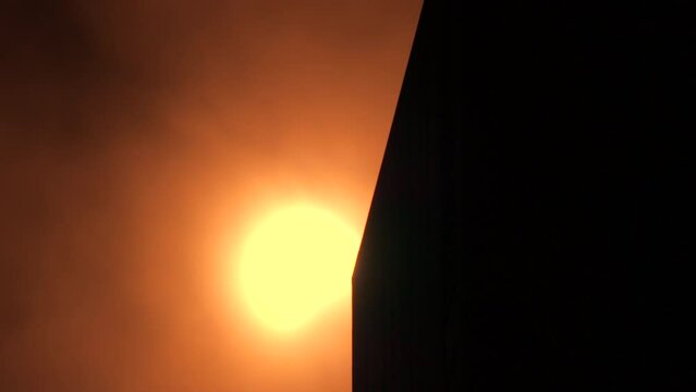 NEW YORK, NEW YORK USA &ndash; APRIL 8, 2024: Solar eclipse just begins next to the tower in Billionaires' Row among Midtown Manhattan skyscraper on April 8, 2024 in New York City.
