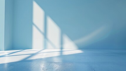 Light blue empty wall and smooth floor with interesting light glare. Background for the presentation.