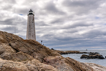 Spring photo of Five Mile Point Lighthouse AKA Old New Haven Harbor Lighthouse, in New Haven, CT, on a cloudy day.