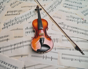Fototapeta premium Brown Wooden Viola and Bow with Staff Paper as Background AI