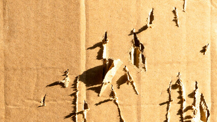 Brown color ripped abstract cardboard box