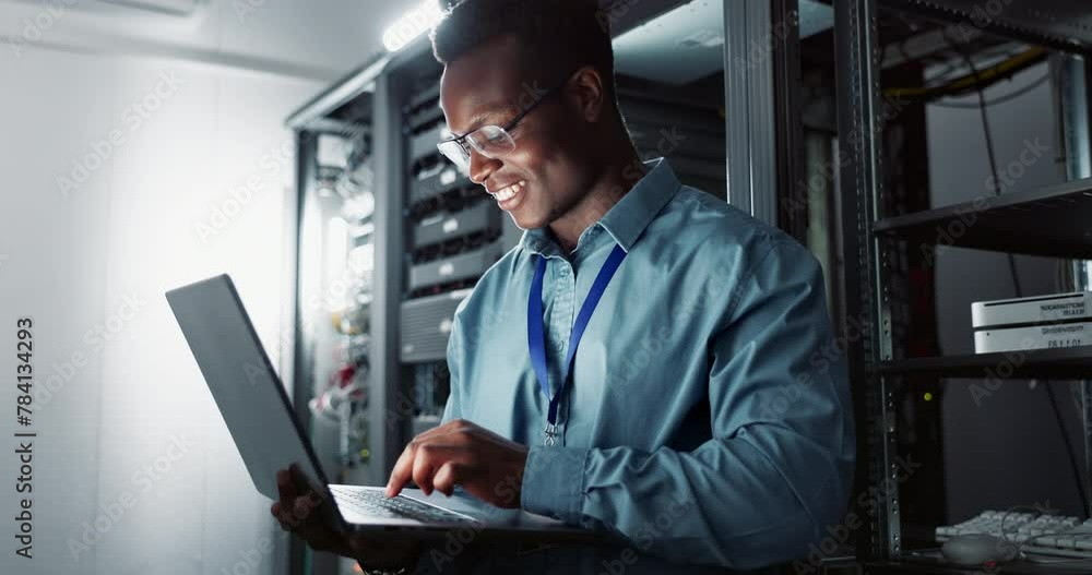 Poster Server room, black man and laptop with typing, programming and code in a workplace. African person, employee and IT specialist with computer and internet with technology, inspection or cyber security