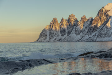 Sunset over the sea by the mountains
