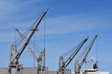Fototapeta na wymiar Cranes on large freighter.