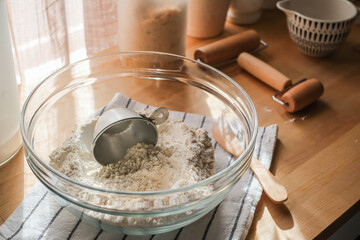 Decorative kitchen top with bread making utensil and flour in the glass bowl for food and baking...