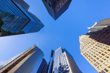 Modern skyscrapers business office buildings dominate urban landscape in Manhattan, New York USA
