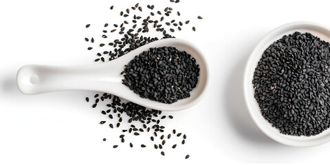 Black cumin seed in wooden bowl isolated on white background.  A pile of natural nigella sativa seeds,