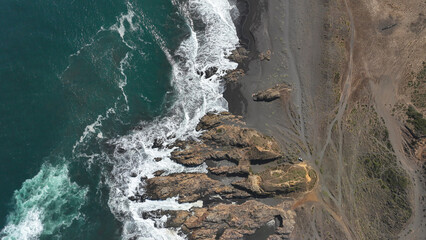 Drone aerial view of arco Calan coast near Constitucion Chile, Pacific ocean, Top view - obrazy, fototapety, plakaty