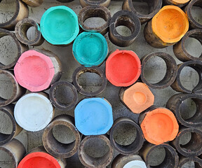 Bamboo cut into pieces and painted to make wall or fences. Colorful abstract background, vintage or retro exterior style and natural material for decorated place concept.