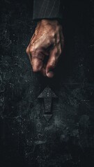 A strong, detailed image of a hand with a dark, textured arrow symbol below it, evoking themes of direction, decision-making, and leadership.