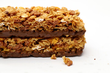 Granola bar with chocolate isolated on white background