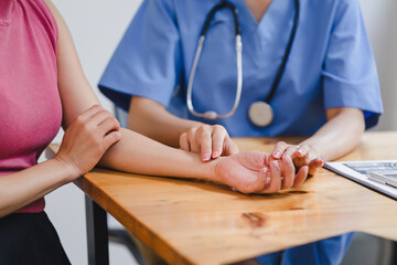 Healthcare professional taking a patient's pulse, emphasizing personal care and attention in a...
