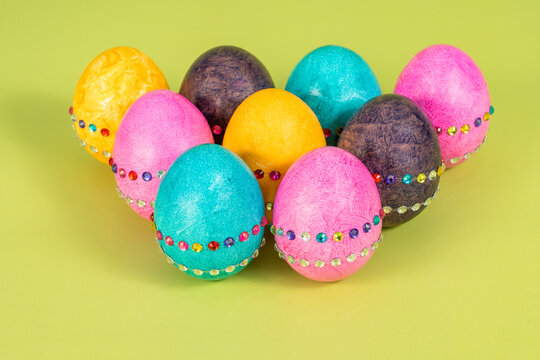 Nine isolated colored and decorated Easter eggs