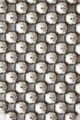 magnetic ball bearing tiling in perfect hexagonal grid. Metal balls close up. Balls of neodymium...
