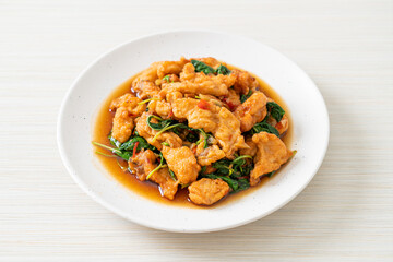 stir-fried fried fish with basil and chili in thai style