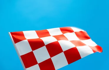 Poster Checkered flag waving on blue background © xy