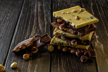 Chocolate bar pieces. Background with chocolate. Sweet food photo concept.