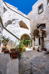 Streets of Chora and iconic Monastery of Saint John the Theologian in chora of Patmos island, Dodecanese, Greece