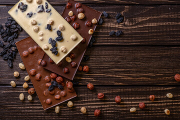 Chocolate bar pieces. Background with chocolate. Sweet food photo concept.