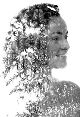 A double exposure female portrait merged with young tree branches photo - 784240205