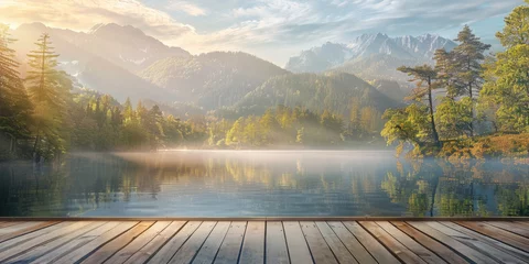 Poster Wooden pier on the lake with the view of the mountains and forest at sunrise © Aleksandr Bryliaev