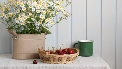 flowers and berries on the table, rural still life. cherries and daisies. cottage core.