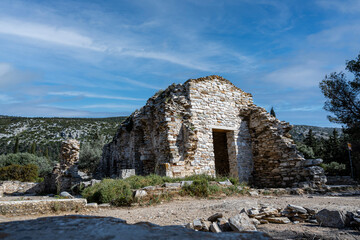 Ruins of an early Christian church located at mountain Hymettus at Athens-Greece. Nice blue sky at the background.