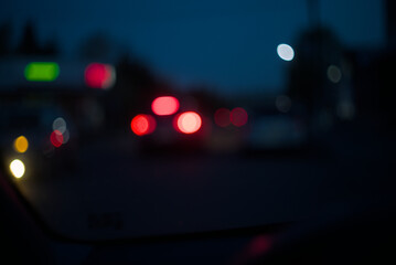 Fototapeta na wymiar Small town street lights at the evening, blurred.