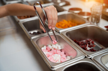 Baby girl in the workshop during a lesson on making handmade chocolates and sweets