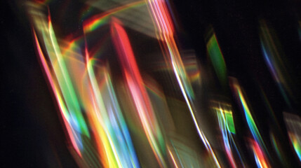 A prism-like distortion of light with intense reds and yellows, creating a fiery, energetic abstract.