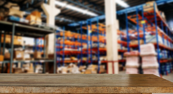 Empty top of wooden shelves on warehouse template background for product display. space.