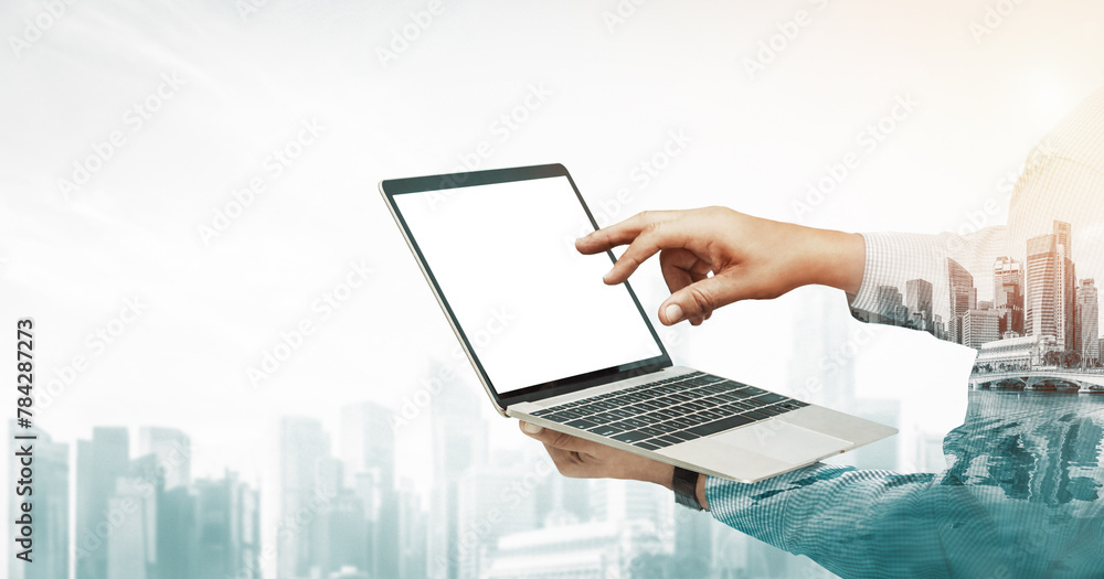 Poster double exposure image of businessman using computer on abstract modern city background. future busin