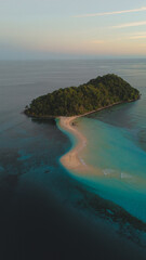 Aerial View of a Beautiful Tropical Island with White Sand Beach and Turquoise Sea