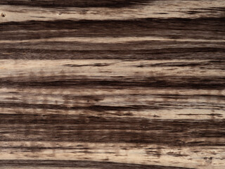 Detailed texture of rich, brown harborica wooden texture surface in close up