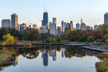 Fototapeta premium Chicago skyline with skyscrapers viewed from Lincoln Park over lake