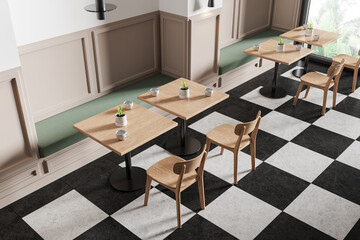 Top view of cafe interior with chairs and tables in row, panoramic window