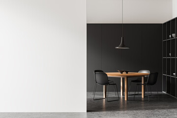 Modern dining room interior with a wooden table, black chairs, and a pendant lamp. Black and white...