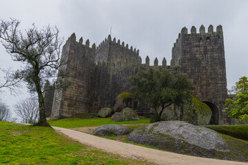 Guimaraes, Portugal.  The Castle of Guimaraes is a Portuguese National Monument referred to as the...