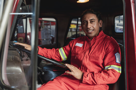 Portrait of fire truck driver smiling at fire station
