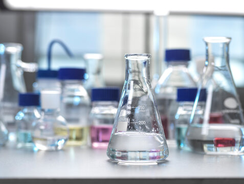 Laboratory glassware being used to develop a chemical formula.