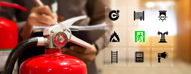 Fire extinguisher has engineer checking with fire protection icons symbol to prepare fire equipment for prevention in emergency case and safety or rescue and alarm system training concept.
